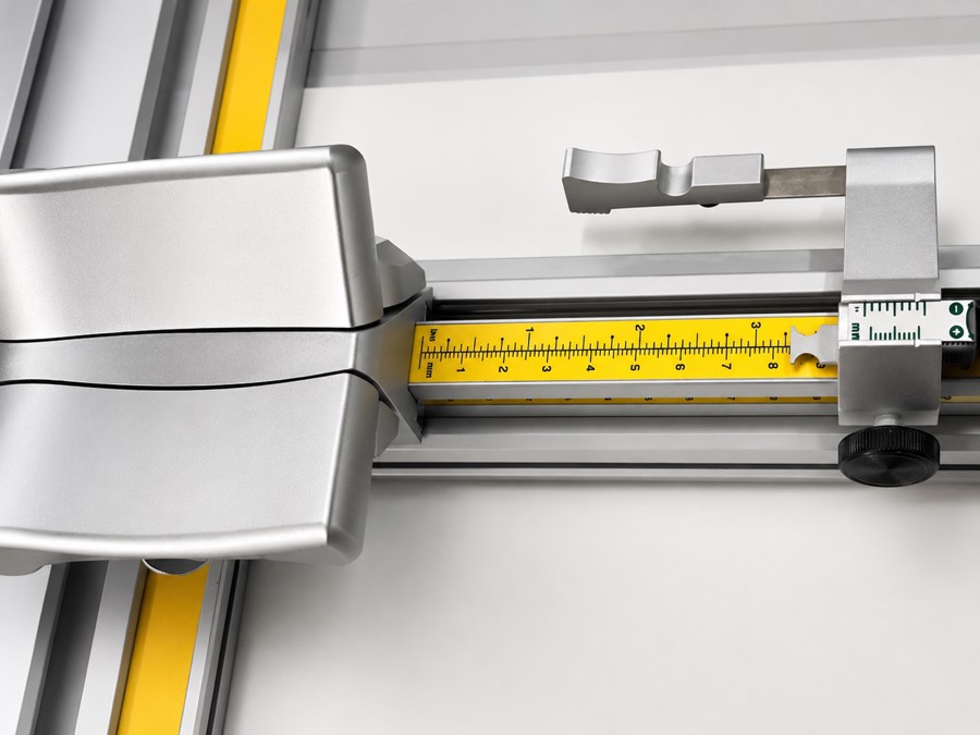 Mount cutter cutting a bevelled window into mount board